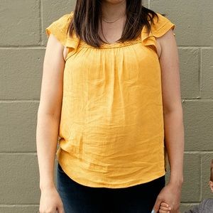 Women’s mustard top, size med.